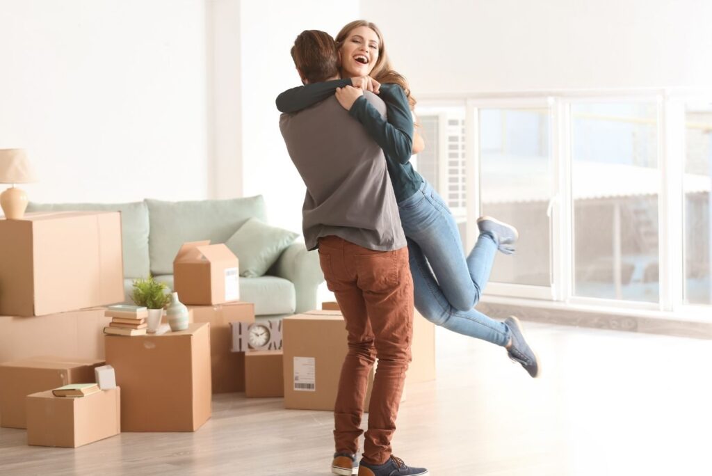 young couple celebrating their first house