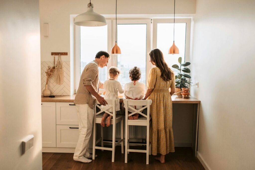 Back view of a family in the house