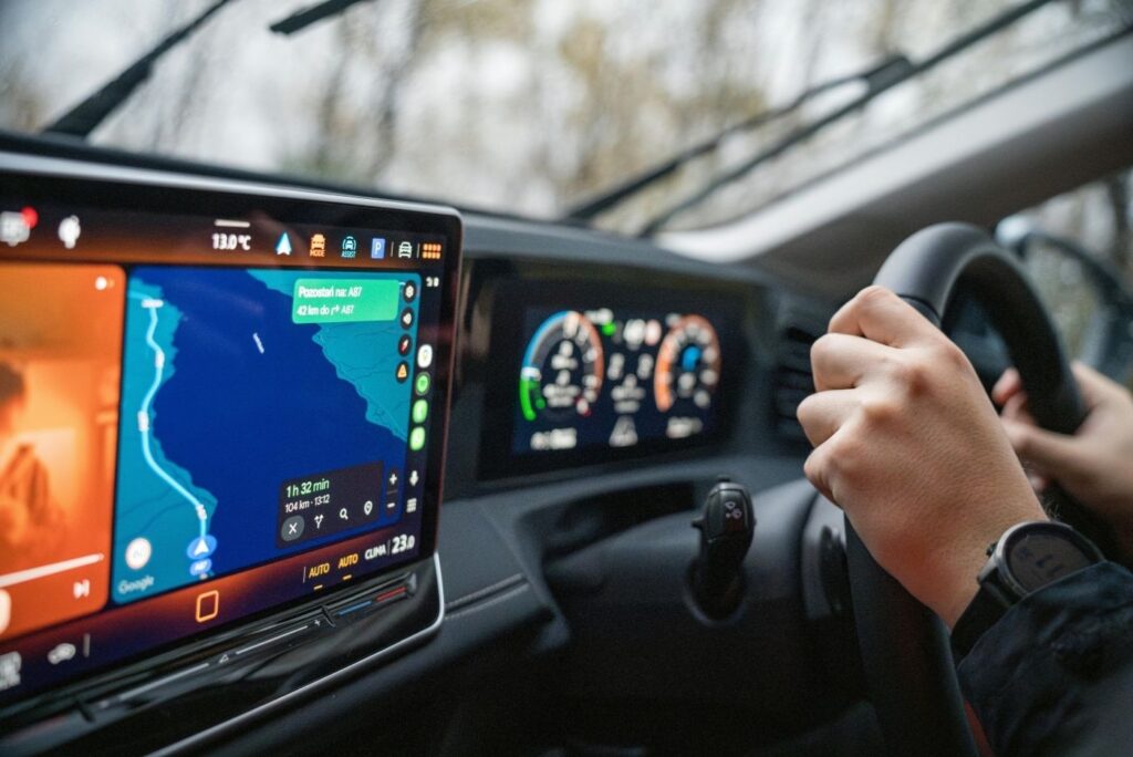 Driving with GPS navigation on car dashboard